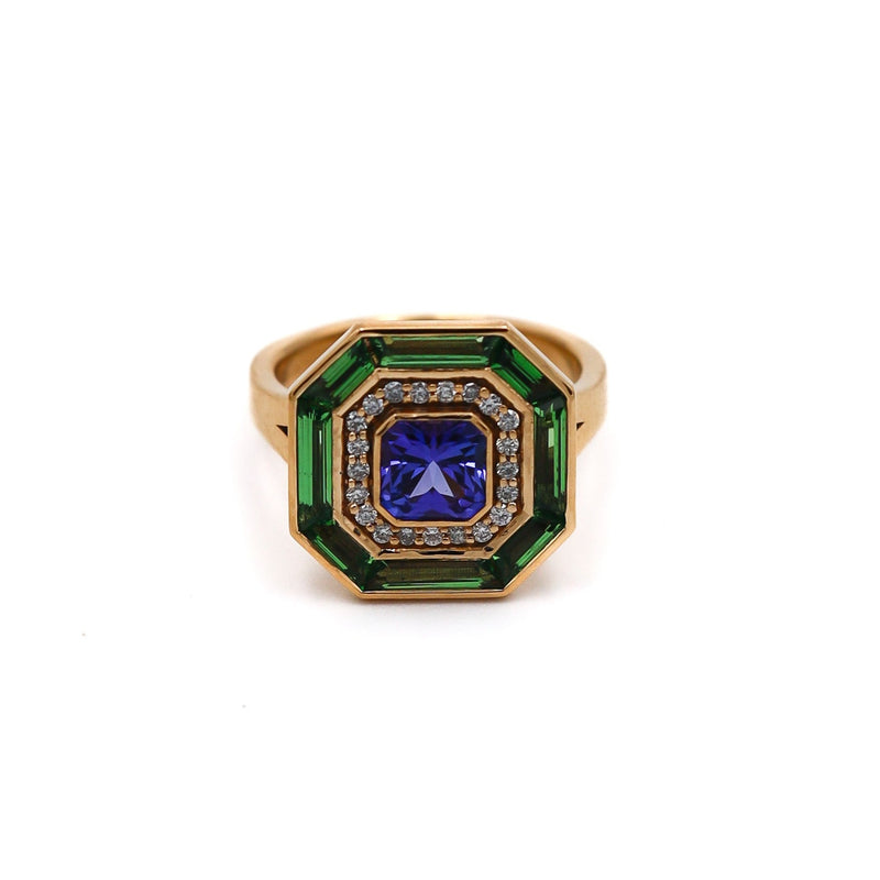 Exquisite 1.15ct Tanzanite ring in 18k yellow gold, surrounded by diamonds and green tsavorites, UK size M